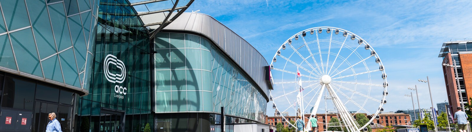 Delegates arriving at a large UK exhibition hall with accredited event access